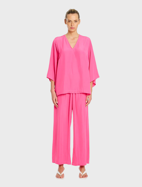 Pink Pace Pant displayed on a white background, showcasing a sleek design suitable for athletic or casual wear.