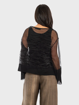 A black Pacos top presented on a hanger, emphasizing its modern cut and versatile appeal.