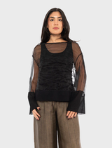 Black Pacos top displayed on a hanger, showcasing its sleek design and fabric texture.