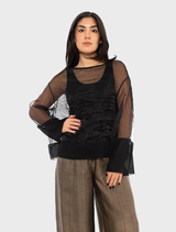 A black Pacos top presented on a hanger, illustrating its contemporary design and soft fabric.
