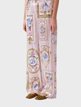 The image features a model in a pink and white floral jumpsuit, identified as Button Front Lounge Pant  Palapast.