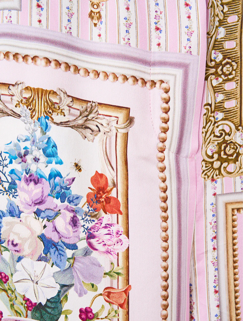 A pink and white striped scarf adorned with floral patterns, complementing the Button Front Lounge Pant Palapast.