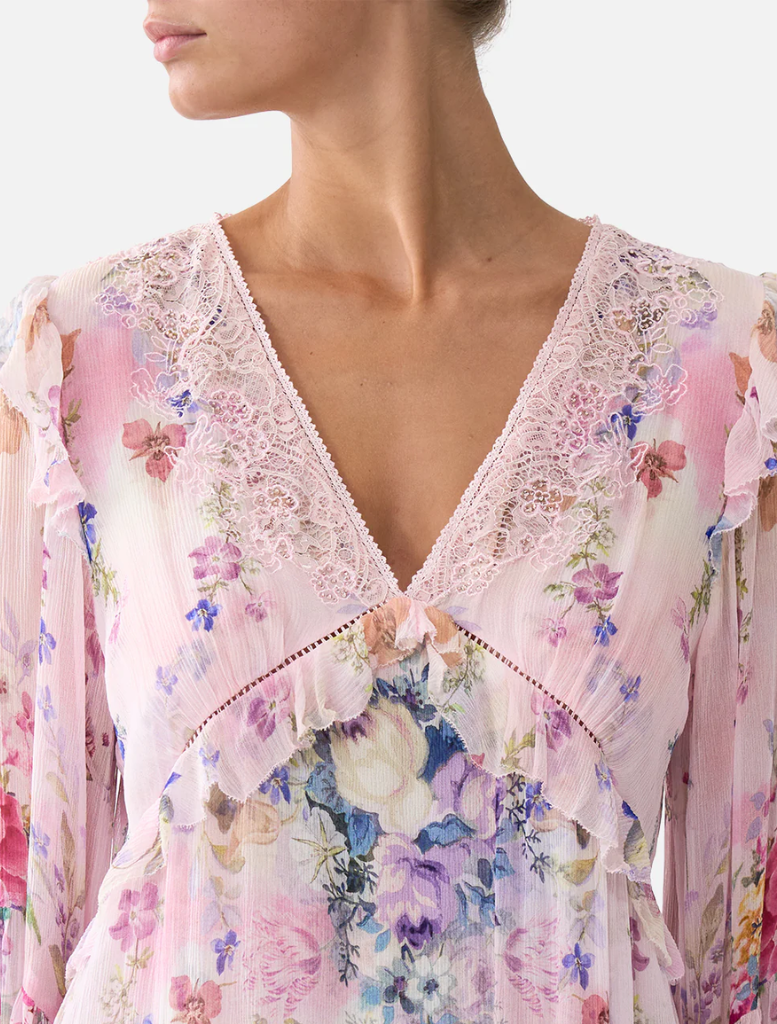 A pink floral print tiered swing mini dress by Palapast perfect for casual outings.