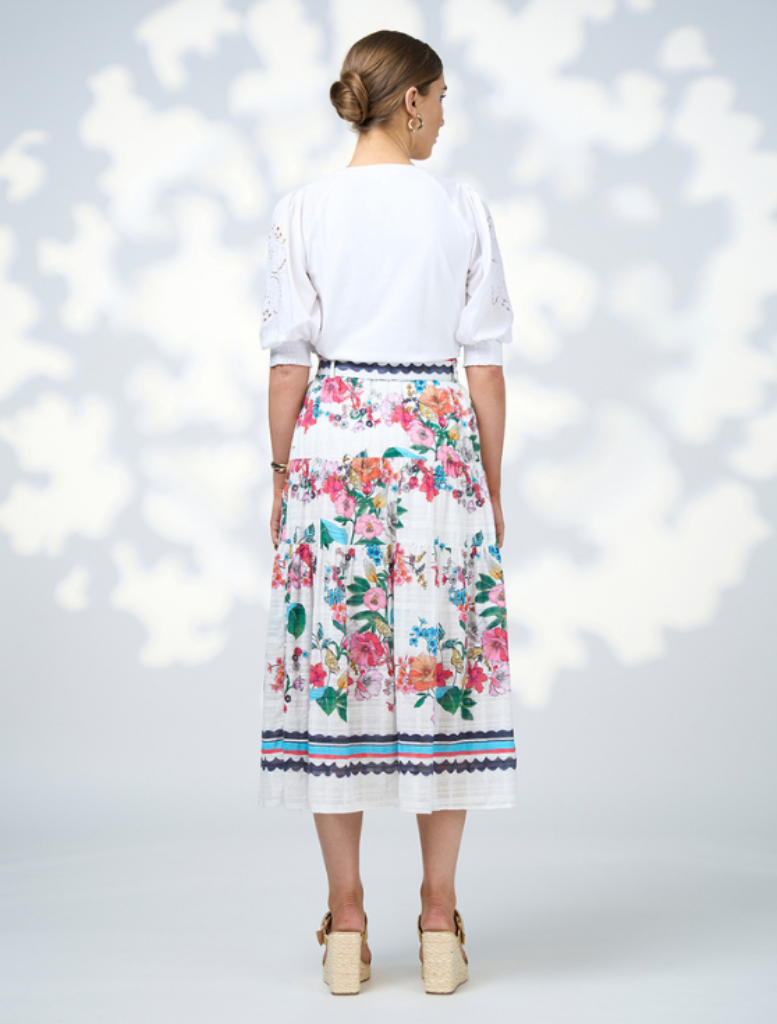 White and blue floral cotton blend skirt, named Pandora Skirt - White Multi, showcasing a vibrant and stylish design.
