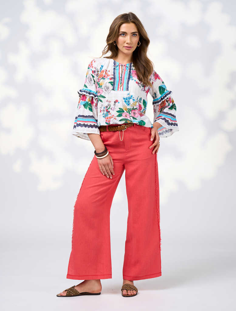 Elegant long-sleeve white floral dress with ruffles at the hem, named Pandora Blouse - White Multi.
