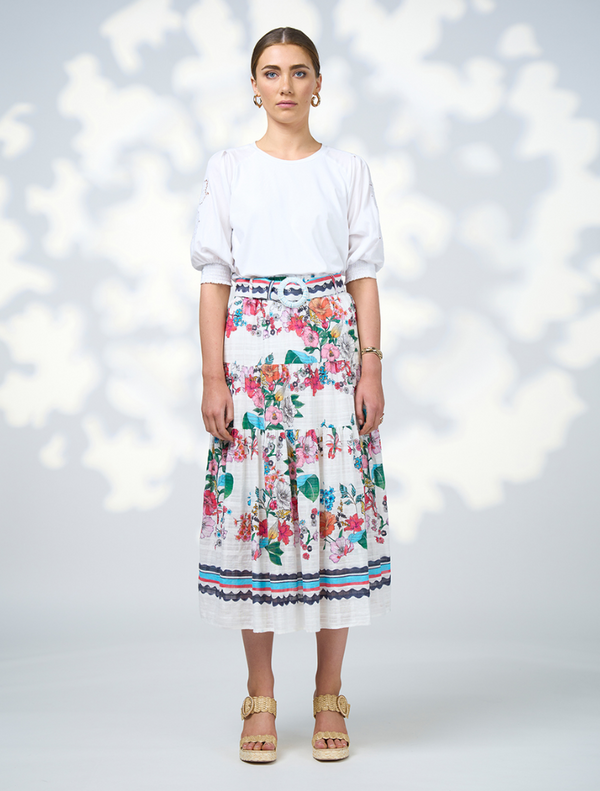 A floral skirt in white and blue, the Pandora Skirt - White Multi is made from a soft cotton blend for a stylish look.