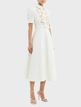 Elegant white dress with lace accents on the collar, identified as the Parrish Short Sleeve Midi Dress in Ivory.