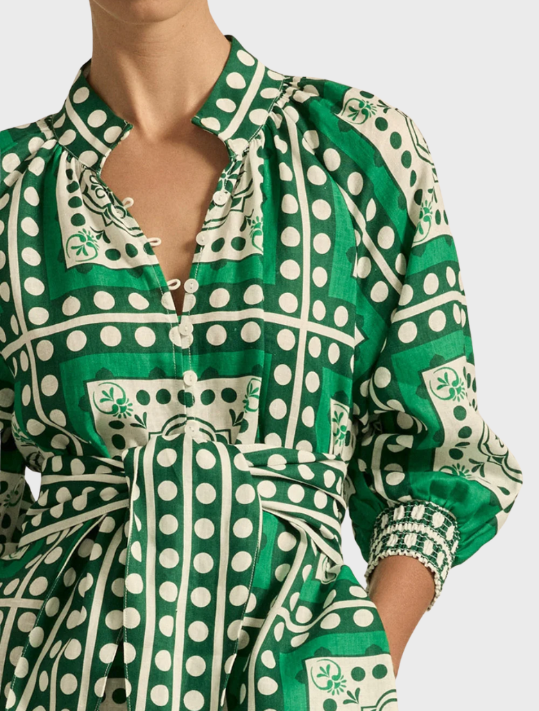 A long sleeve dress in green and white with a square pattern, designed as a stylish shirt dress.