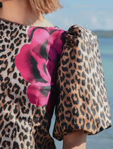 Chic leopard floral dress showcasing structured puff sleeves, fitted silhouette, and a back hem split for comfort.