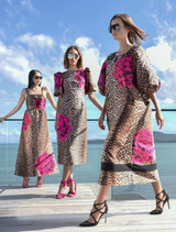 Leopard floral dress with structured puff sleeves, fitted silhouette, and back hem split for ease of movement.