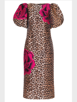 Confident leopard floral dress with structured sleeves, fitted silhouette, and a back hem split for added mobility.
