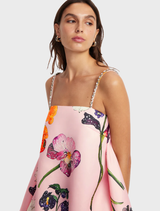 Stylish mini dress with puff sleeves and embellishments by Wildbloom, highlighted by a cheerful floral design.