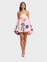 Wildbloom's mini dress with embellished puff sleeves, showcasing a colorful floral design perfect for summer outings.