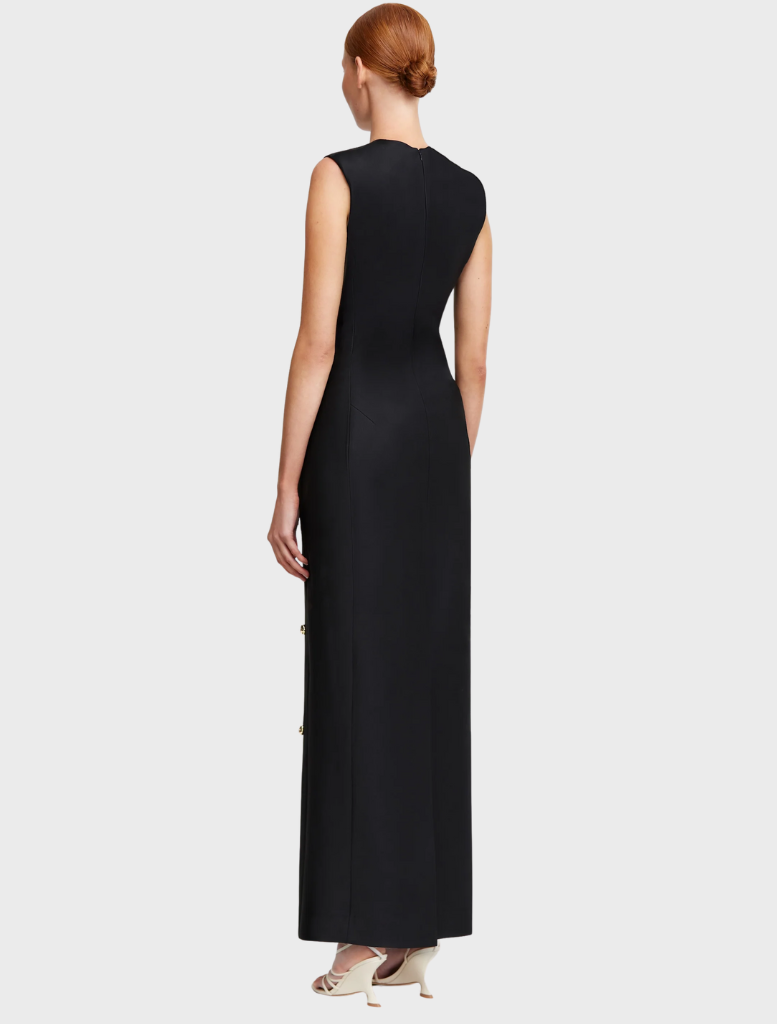 Black evening gown with a stunning gold star design, combining elegance and celestial charm.