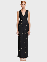  A black evening gown adorned with gold stars, creating a striking and elegant design for formal occasions.
