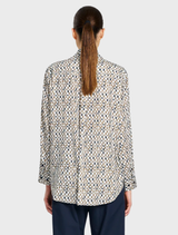 A soft fabric shirt complemented by a pendant, illustrating a perfect mix of comfort and fashionable design.