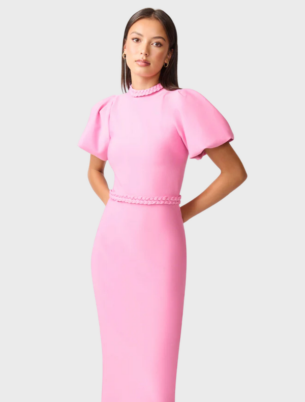 A pink midi dress crafted from stretchy fabric, offering a flattering fit and versatile style for everyday wear.