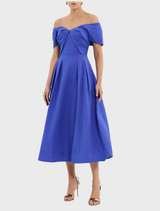 A stylish blue dress with a ruffled neckline, showcasing a chic and feminine design.