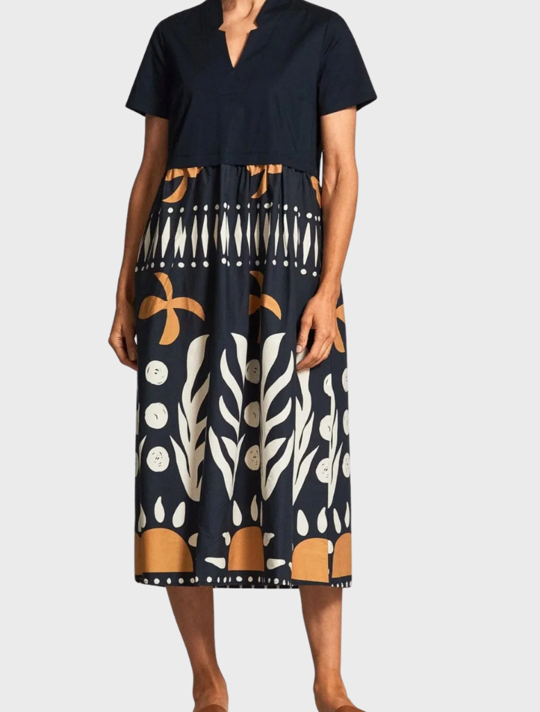 Elegant black and white dress showcasing a patterned design, ideal for formal or casual events.