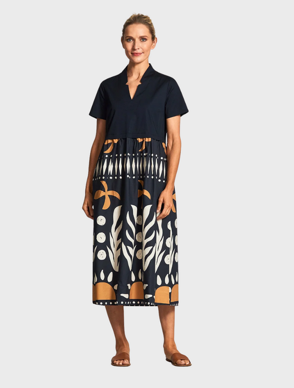  Black and white dress featuring a distinctive pattern, elegantly designed for a stylish look.