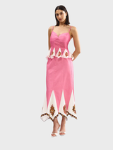 A flowing midi skirt in a vibrant poppy antique color, featuring a stylish design suitable for various occasions.