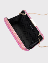 The pink EDITH Iridescent clutch is adorned with color-shifting crystals, complemented by gold hardware and a detachable chain; it accommodates large smartphones.