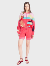 Playful pink bomber jacket featuring a colorful jacquard pattern, crafted from cotton, reflecting urban energy and spontaneity.