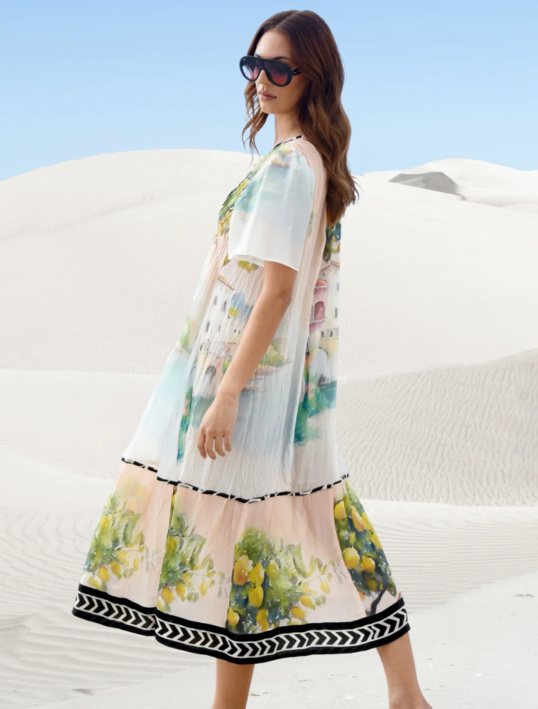 Chic pink dress featuring a unique paint pattern, ideal for making a fashionable statement at any gathering.