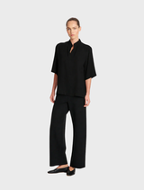 Placket Plaza in black, featuring a sleek design and modern aesthetic suitable for various settings.