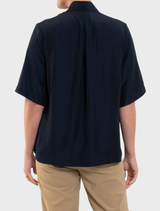Stylish navy Placket Plaza Top designed for comfort and sophistication in everyday wear.