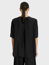 Stylish black Swish Plaza top, designed for comfort and sophistication in any wardrobe.