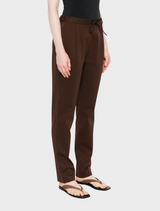High-waisted wool pants in brown, highlighting a sophisticated style, presented on a plain white background.