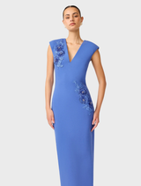 Talitha cornflower blue column dress featuring a plunging neckline, elegant silhouette, and sophisticated design.