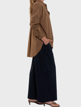 Saddle-colored relaxed pocket shirt, offering a comfortable and stylish option for casual attire.