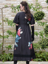 Chic black dress with a vibrant floral design and weasel accents, perfect for a fashionable look.