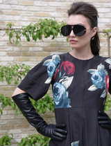 Black floral dress showcasing a playful weasel illustration, great for adding flair to your wardrobe.