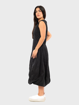 Black poplin dress featuring a unique print, showcasing a stylish and modern design suitable for various occasions.