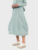 Mint poplin skirt featuring a vibrant print, showcasing a stylish and modern design suitable for various occasions.