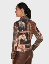 Back view of a woman in a dark brown and black knit jacket featuring a horse print design.