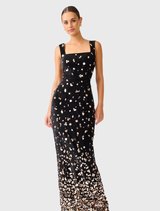Floor-length black velvet gown adorned with gold embellishments, featuring a sleek design and partially lined for comfort.

