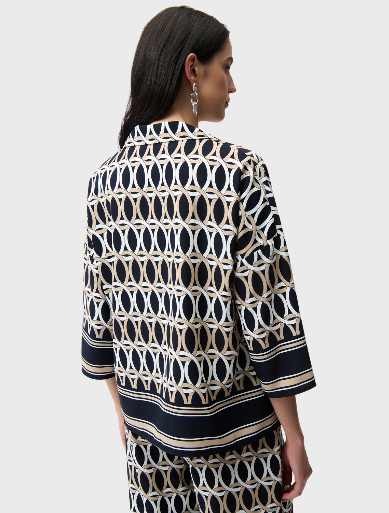 Chic midnight blue top featuring multi-colored highlights, designed for versatility in fashion choices.