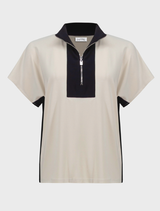 Stylish top in moonstone and black, highlighting a contemporary and elegant aesthetic.