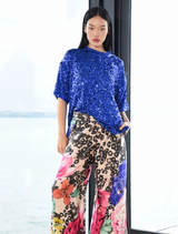 Fluid wide-leg trousers in vintage floral design, featuring side splits, elasticated back, and side pockets for comfort and style.