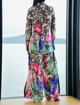Vintage floral wide-leg trousers featuring high side splits, elastic waistband, and side pockets for a stylish, comfortable fit.