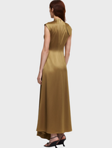 Elegant gold silk dress adorned with a bow at the neck, highlighting its refined and fashionable design.