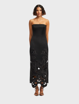 A black maxi dress featuring an appliqué bustier design, elegantly draping to the floor.