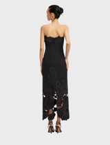 Stylish ebony maxi dress with a fitted appliqué bustier, ideal for evening events.