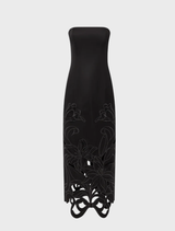 Black maxi dress with a decorative bustier, combining elegance and comfort for a chic evening look.