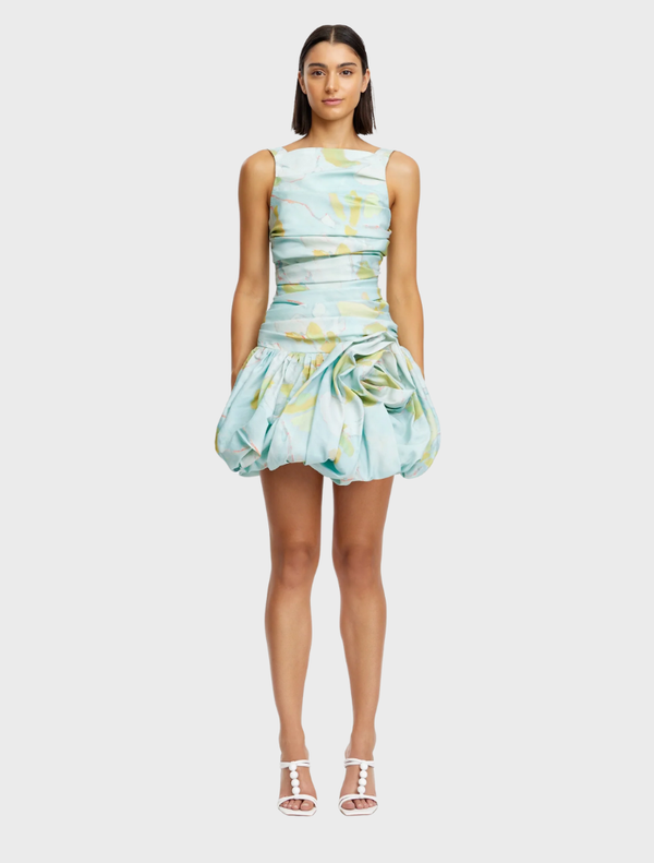 Blue plum mini dress with a forest print, featuring a fitted silhouette and short sleeves, perfect for casual outings.