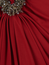  Red Aspen Gown featuring a fitted silhouette, long sleeves, sculpted bodice, and hand-embellished detailing on the skirt.
